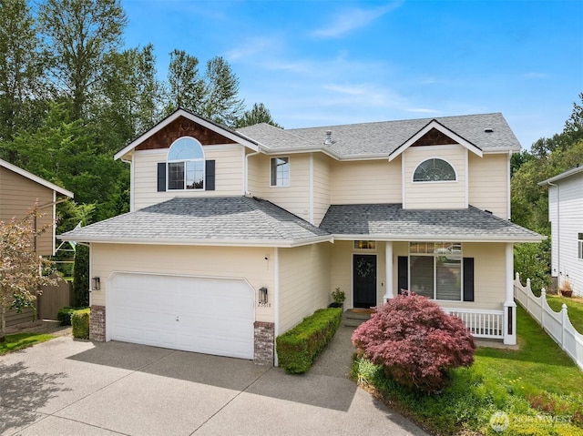 23618 Carter Rd, Bothell, WA 98021 - traditional home with concrete driveway, a porch, and a shingled roof