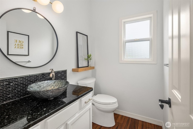 23618 Carter Rd, Bothell, WA 98021 - bathroom with vanity, wood finished floors, and tasteful backsplash