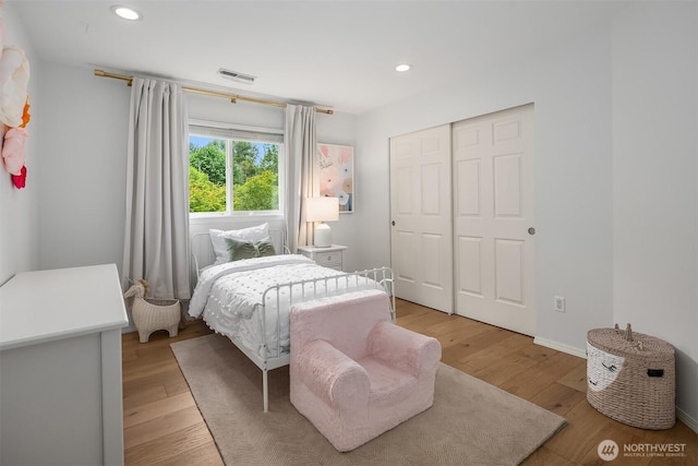23618 Carter Rd, Bothell, WA 98021 - bedroom with light wood finished floors, a closet, and recessed lighting