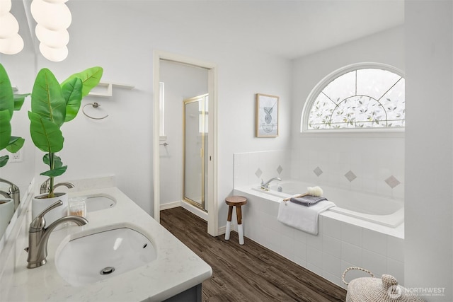 23618 Carter Rd, Bothell, WA 98021 - full bath with double vanity, a stall shower, a garden tub, and wood finished floors