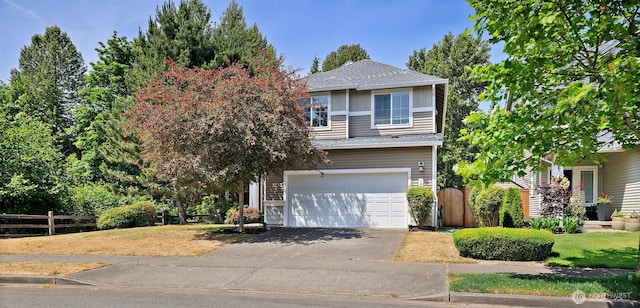 16922 SE 262nd St, Covington, WA 98042 - view of front of home with an attached garage, asphalt driveway, and a shingled roof