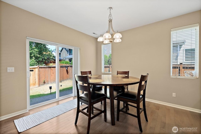 16922 SE 262nd St, Covington, WA 98042 - dining space with a chandelier and wood finished floors