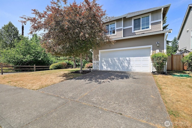 16922 SE 262nd St, Covington, WA 98042 - view of front of home with board and batten siding, a garage, and driveway