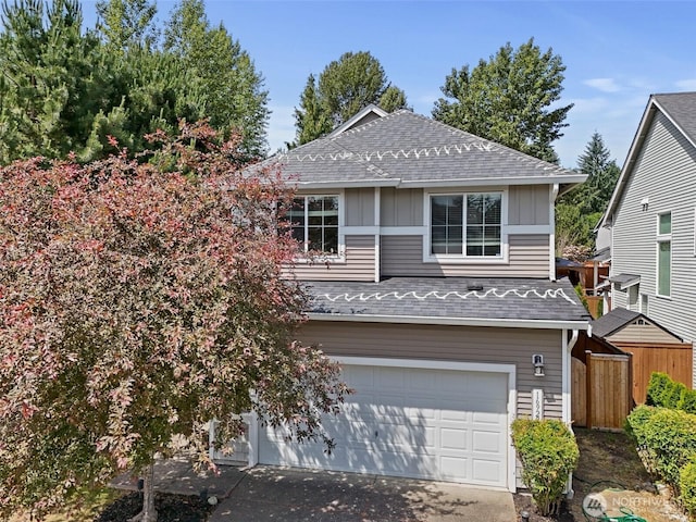 16922 SE 262nd St, Covington, WA 98042 - view of front of house with a shingled roof, board and batten siding, a garage, and concrete driveway