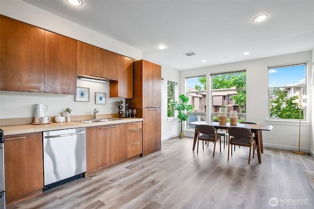 1214 N Northgate Way, Seattle, WA 98133 - kitchen featuring dishwasher, brown cabinets, light wood-style floors, and recessed lighting