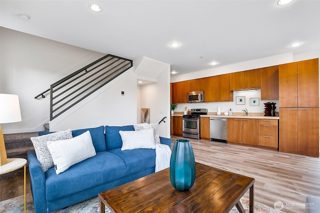 1214 N Northgate Way, Seattle, WA 98133 - living area with light wood-type flooring, recessed lighting, and stairway