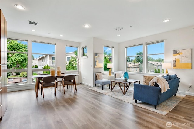 1214 N Northgate Way, Seattle, WA 98133 - living area featuring healthy amount of natural light, wood finished floors, and recessed lighting