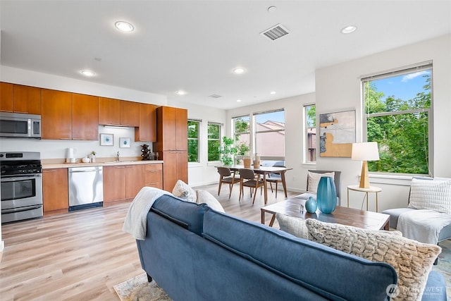 1214 N Northgate Way, Seattle, WA 98133 - living room featuring light wood finished floors and recessed lighting