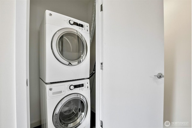 1214 N Northgate Way, Seattle, WA 98133 - washroom featuring stacked washer and clothes dryer