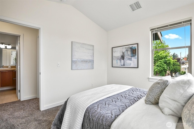 1214 N Northgate Way, Seattle, WA 98133 - bedroom with carpet floors, vaulted ceiling, and ensuite bathroom