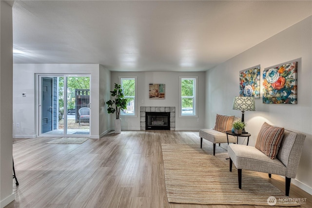 3939 10th St SE Unit C6, Puyallup, WA 98374 - living area with light wood-type flooring and a fireplace