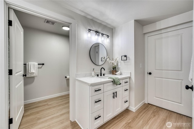 3939 10th St SE Unit C6, Puyallup, WA 98374 - bathroom featuring vanity and wood finished floors