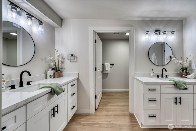 3939 10th St SE Unit C6, Puyallup, WA 98374 - bathroom with two vanities and wood finished floors