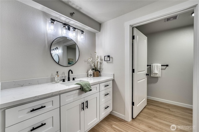 3939 10th St SE Unit C6, Puyallup, WA 98374 - bathroom with wood finished floors and vanity
