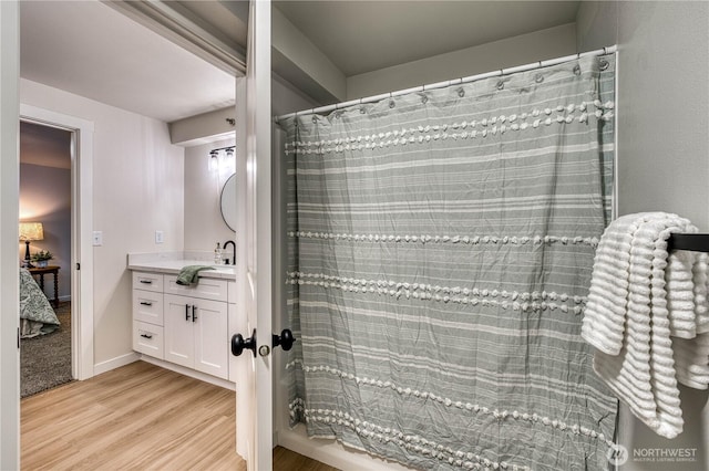 3939 10th St SE Unit C6, Puyallup, WA 98374 - ensuite bathroom featuring vanity, wood finished floors, and a shower with shower curtain