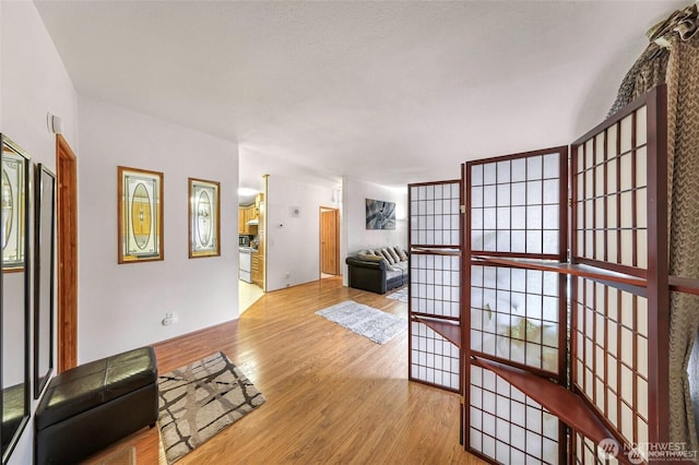 921 Autumn Ln Unit 221, Bellingham, WA 98229 - unfurnished living room featuring wood finished floors
