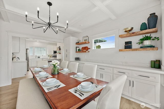 3209 S 8th St, Tacoma, WA 98405 - dining area featuring a chandelier, beamed ceiling, and light wood finished floors