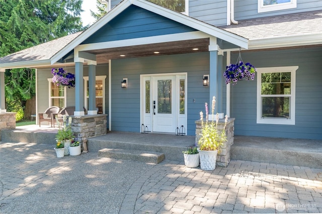 19838 Bear View Ln SW, Rochester, WA 98579 - property entrance featuring covered porch, a shingled roof, and a chimney