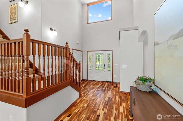 19838 Bear View Ln SW, Rochester, WA 98579 - foyer entrance featuring a high ceiling, wood finished floors, stairway, and arched walkways