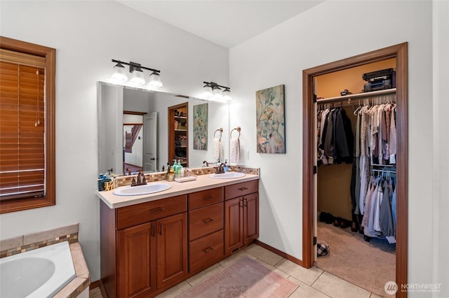 19838 Bear View Ln SW, Rochester, WA 98579 - full bath with tile patterned flooring, double vanity, a tub, and a walk in closet
