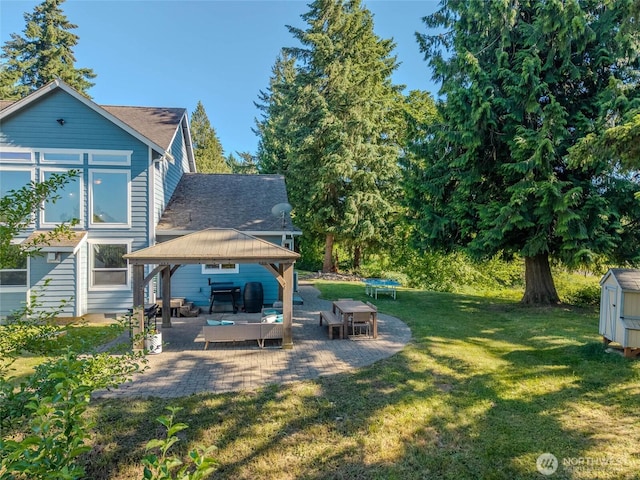 19838 Bear View Ln SW, Rochester, WA 98579 - view of grassy yard with a gazebo, a patio area, and a storage shed