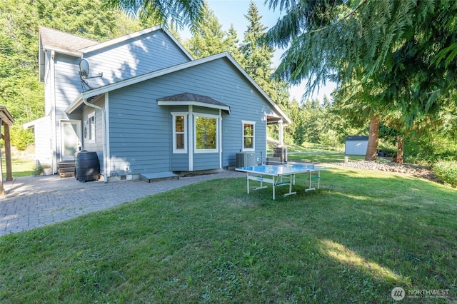 19838 Bear View Ln SW, Rochester, WA 98579 - back of house featuring a shed, a yard, and a patio area