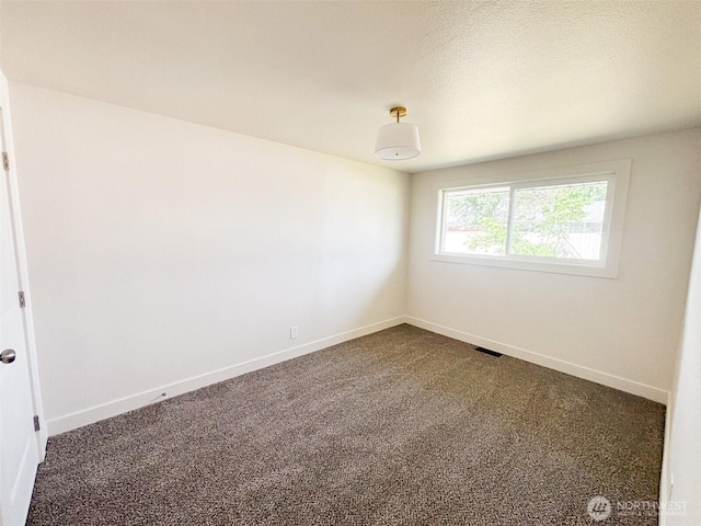 308 N Dale Rd, Moses Lake, WA 98837 - spare room with dark carpet and baseboards