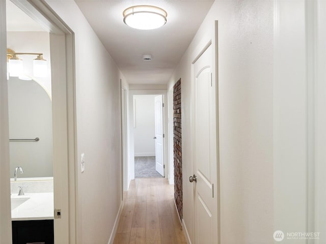 308 N Dale Rd, Moses Lake, WA 98837 - hallway featuring light wood-style flooring and baseboards
