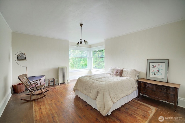 906 E Shelby St, Seattle, WA 98102 - bedroom featuring radiator, ornamental molding, and wood-type flooring