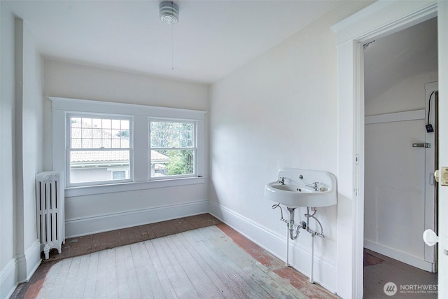 906 E Shelby St, Seattle, WA 98102 - bathroom with radiator and hardwood / wood-style floors