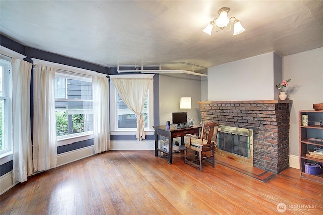 906 E Shelby St, Seattle, WA 98102 - home office featuring a brick fireplace and wood-type flooring