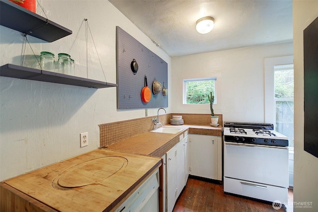 906 E Shelby St, Seattle, WA 98102 - kitchen with white gas stove, dark wood-style flooring, healthy amount of natural light, and white cabinets