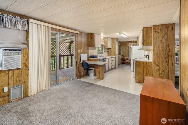 827 211th Pl NE, Sammamish, WA 98074 - kitchen with electric stove, light countertops, wooden walls, extractor fan, and brown cabinets