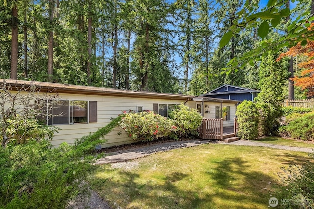 827 211th Pl NE, Sammamish, WA 98074 - view of front of house featuring a wooden deck and a front lawn