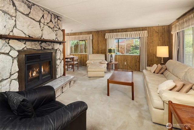 827 211th Pl NE, Sammamish, WA 98074 - living area with wood walls, carpet flooring, and a stone fireplace