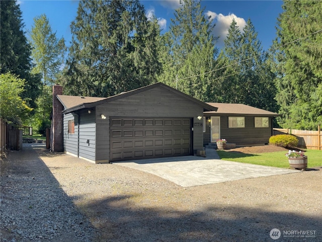 17714 Robinhood Ln, Snohomish, WA 98290 - ranch-style home with driveway, a chimney, and an attached garage