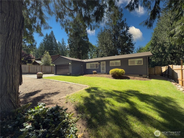 17714 Robinhood Ln, Snohomish, WA 98290 - back of property with an attached garage, crawl space, and a fenced backyard