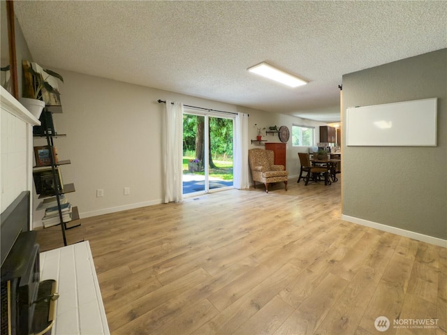 17714 Robinhood Ln, Snohomish, WA 98290 - living area with light wood-style flooring and a textured ceiling