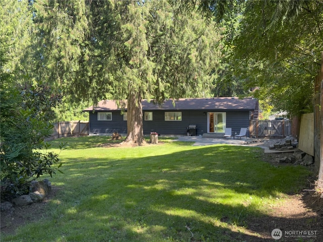 17714 Robinhood Ln, Snohomish, WA 98290 - back of house with a patio area and a fenced backyard