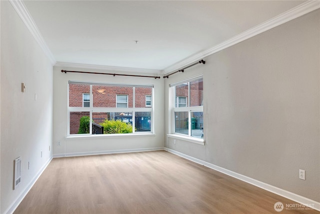 621 5th Ave N Unit 103, Seattle, WA 98109 - unfurnished room featuring crown molding and wood finished floors