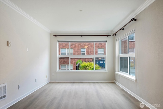 621 5th Ave N Unit 103, Seattle, WA 98109 - empty room featuring ornamental molding and wood finished floors