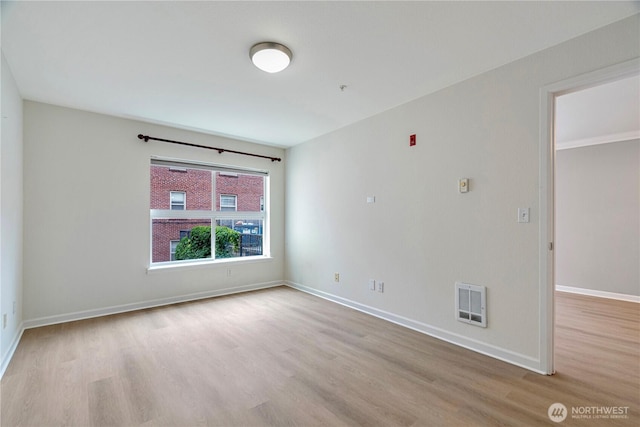 621 5th Ave N Unit 103, Seattle, WA 98109 - spare room with wood finished floors and a pendent fire sprinkler