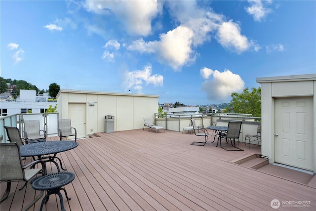 621 5th Ave N Unit 103, Seattle, WA 98109 - wooden terrace featuring outdoor dining area