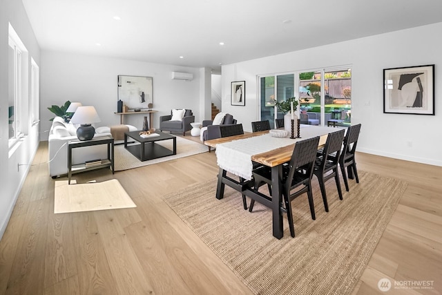 10339 11th Ave NW, Seattle, WA 98177 - dining room with an AC wall unit, light wood-style flooring, and recessed lighting