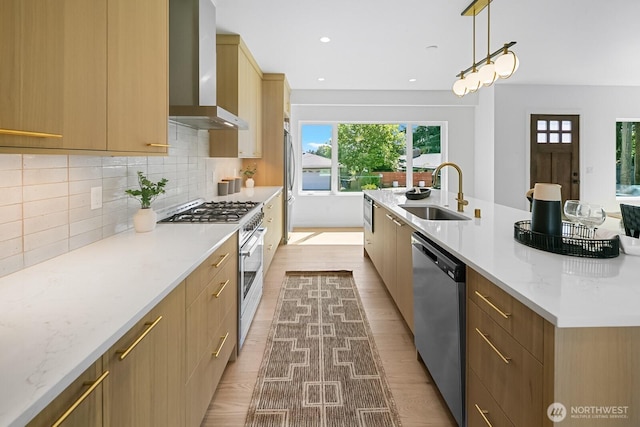 10339 11th Ave NW, Seattle, WA 98177 - kitchen with stainless steel appliances, wall chimney range hood, light wood-style floors, tasteful backsplash, and recessed lighting