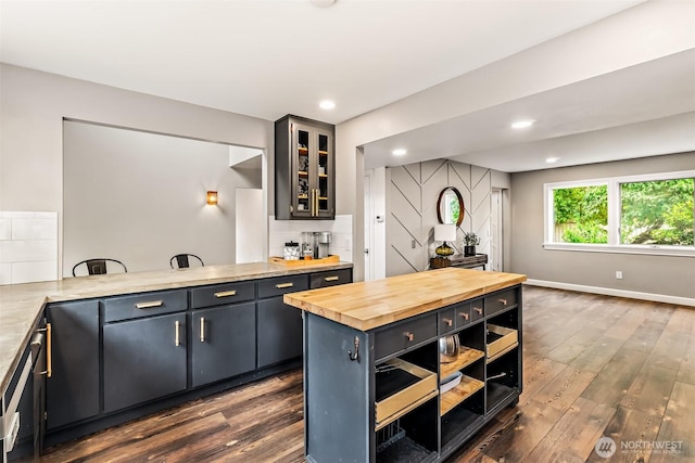 233 Joann Ln, Arlington, WA 98223 - kitchen featuring wooden counters, dark wood-type flooring, backsplash, recessed lighting, and glass insert cabinets