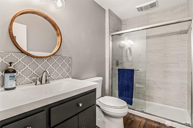 233 Joann Ln, Arlington, WA 98223 - bathroom featuring vanity, a stall shower, and wood finished floors