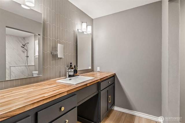 233 Joann Ln, Arlington, WA 98223 - full bathroom featuring a shower, vanity, and wood finished floors