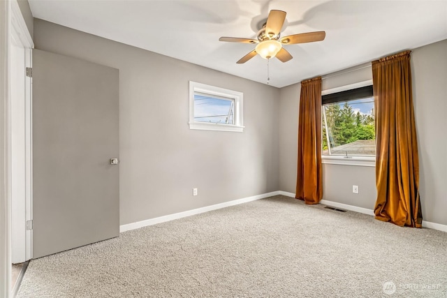 233 Joann Ln, Arlington, WA 98223 - carpeted empty room featuring plenty of natural light and a ceiling fan