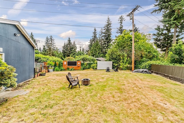 233 Joann Ln, Arlington, WA 98223 - view of yard featuring a fire pit and an outbuilding